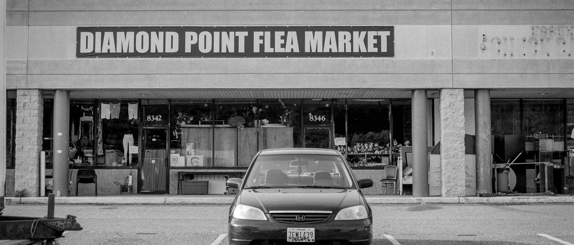 Diamond Point Flea Market sign and flea market inside of the abandoned buildings
